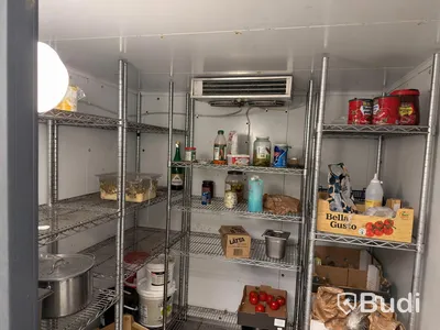 Walk-in cooler with refrigeration unit and shelving