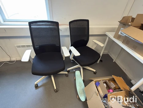 Two office chairs with mesh backs