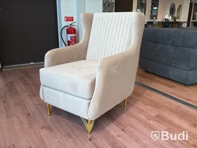 Fåtölj i beige sammet