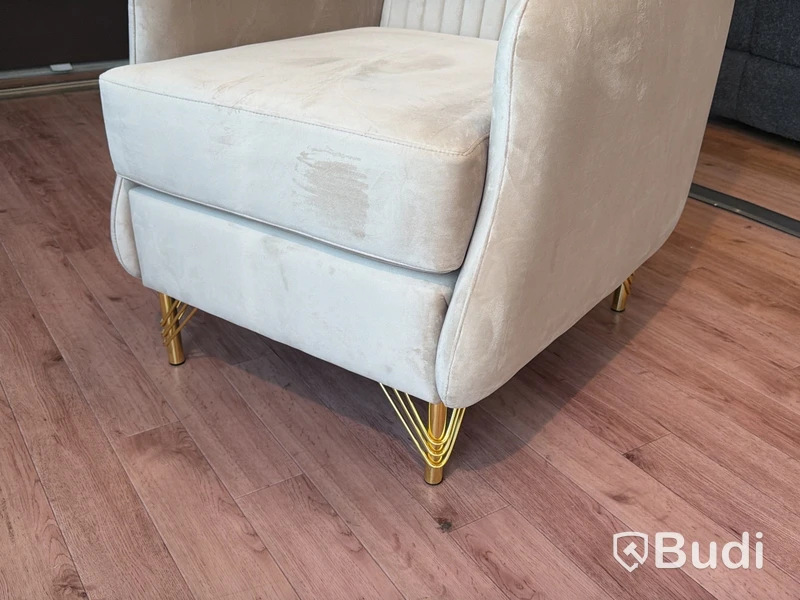 Fåtölj i beige sammet
