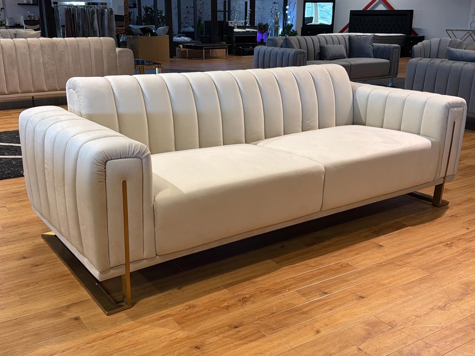 Soffa i beige sammet