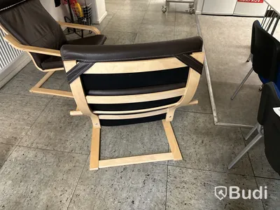 2 st fåtöljer, trästomme, mörkbrun läderimitation