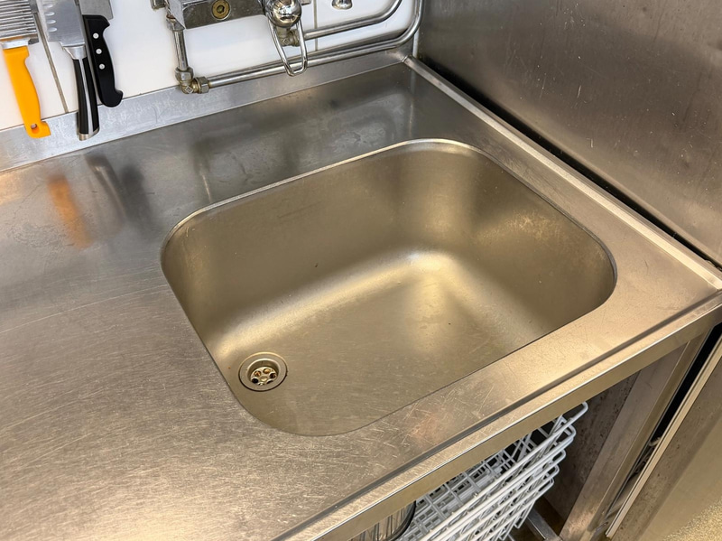 Stainless steel work table with sink