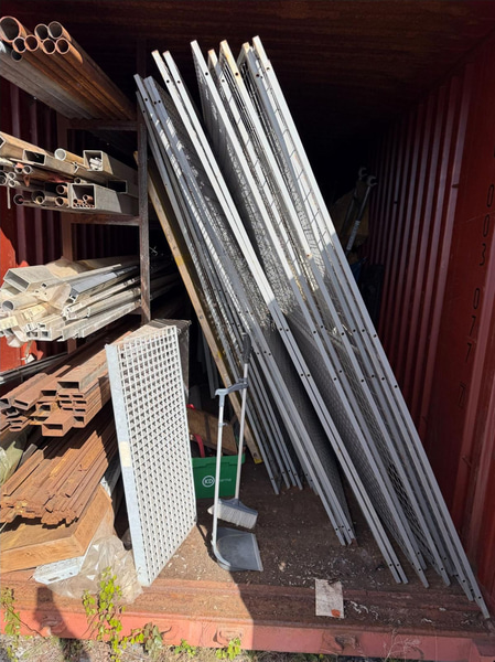 20-foot container with assorted materials (surplus materials and temporary cold-room doors)