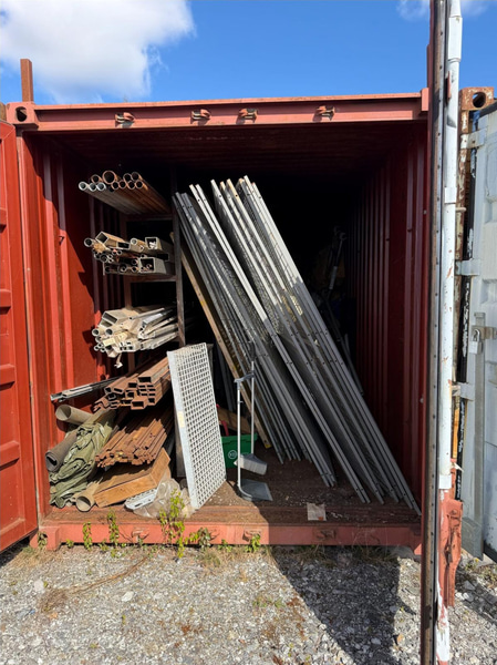 20-foot container with assorted materials (surplus materials and temporary cold-room doors)