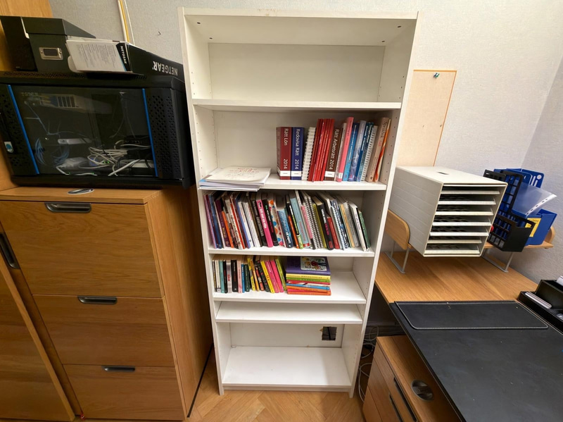 Bookcase with assorted non-fiction books