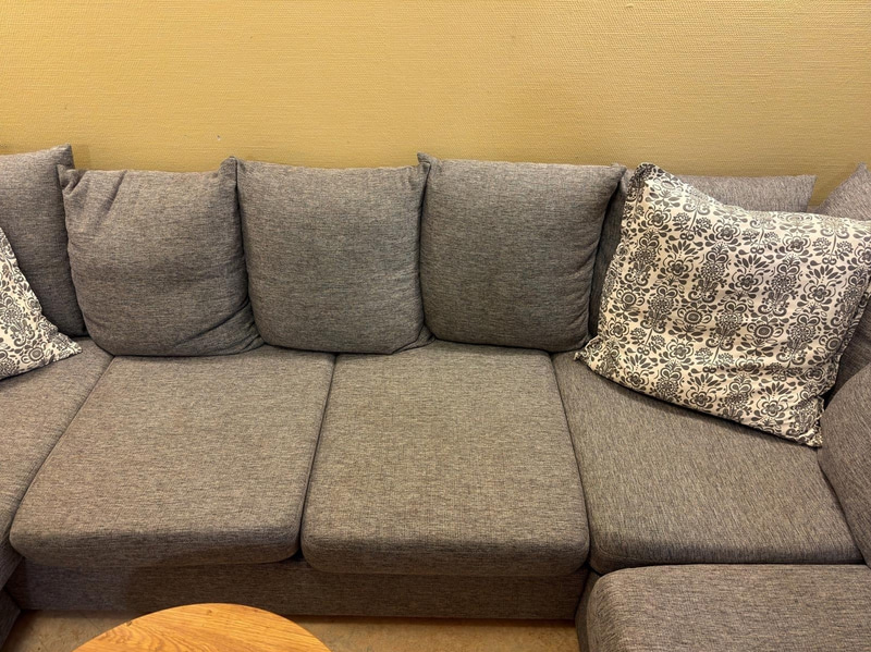 Sofa with chaise sections, coffee table and armchair