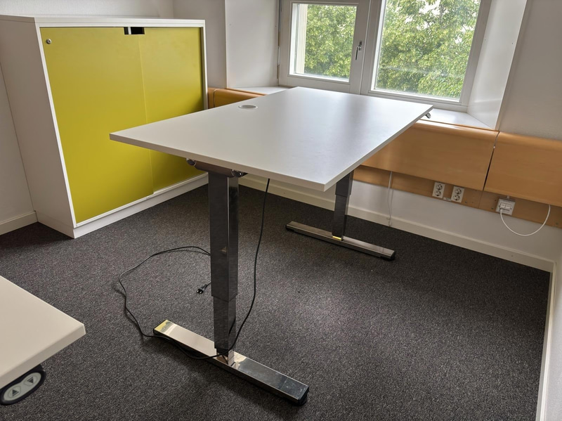 2 height-adjustable desks
