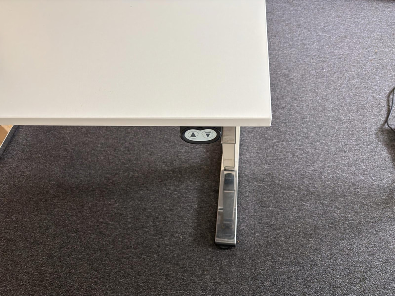 2 height-adjustable desks