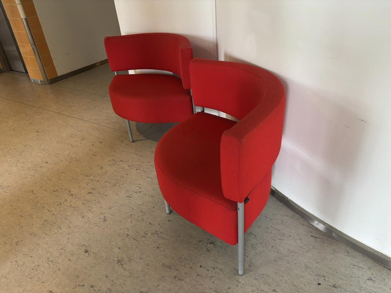2 red Mitab armchairs