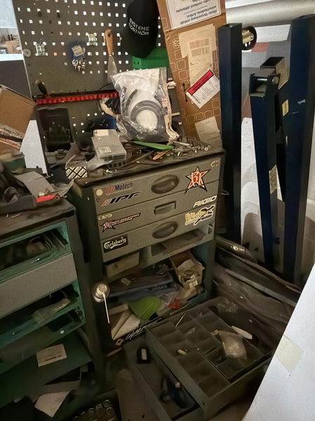 2 tool trolleys with tools and an engine hoist
