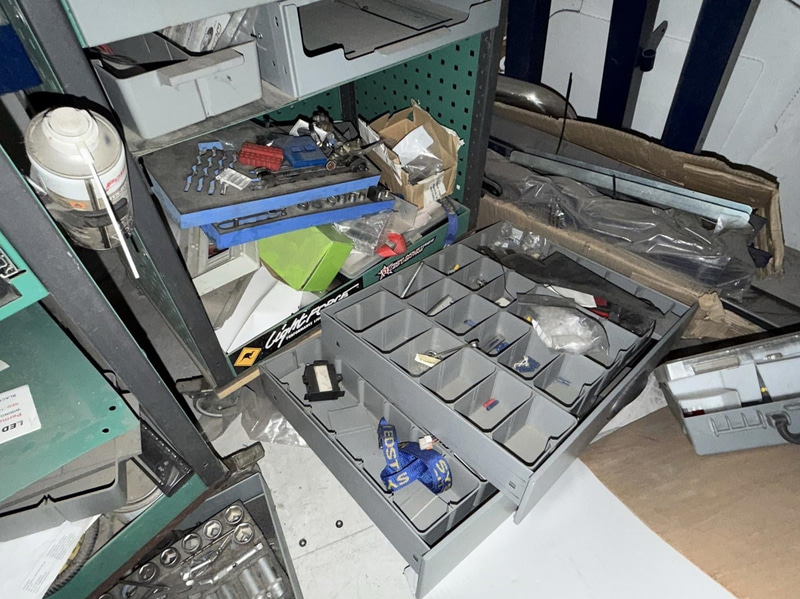 2 tool trolleys with tools and an engine hoist