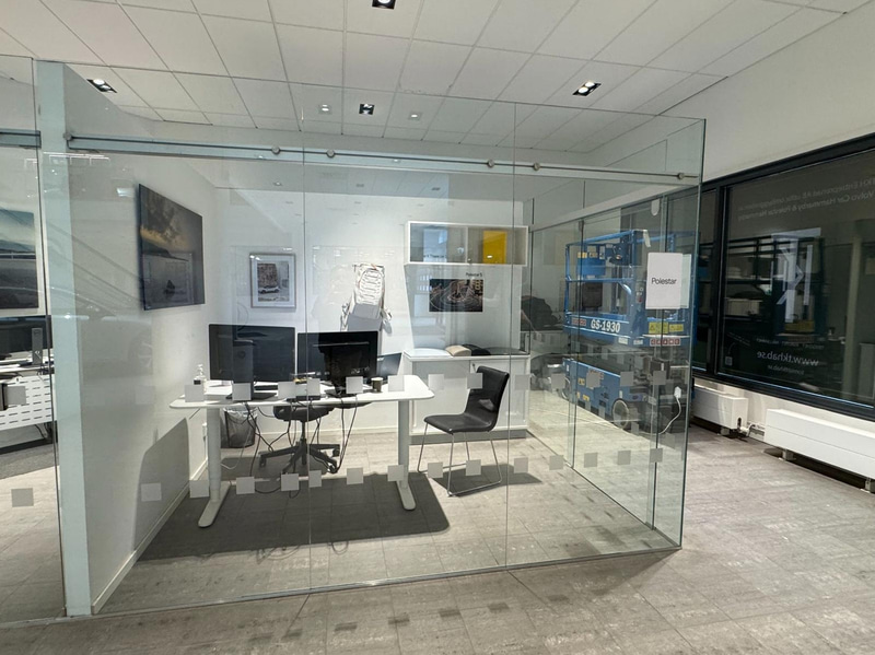 Glass partition with sliding door