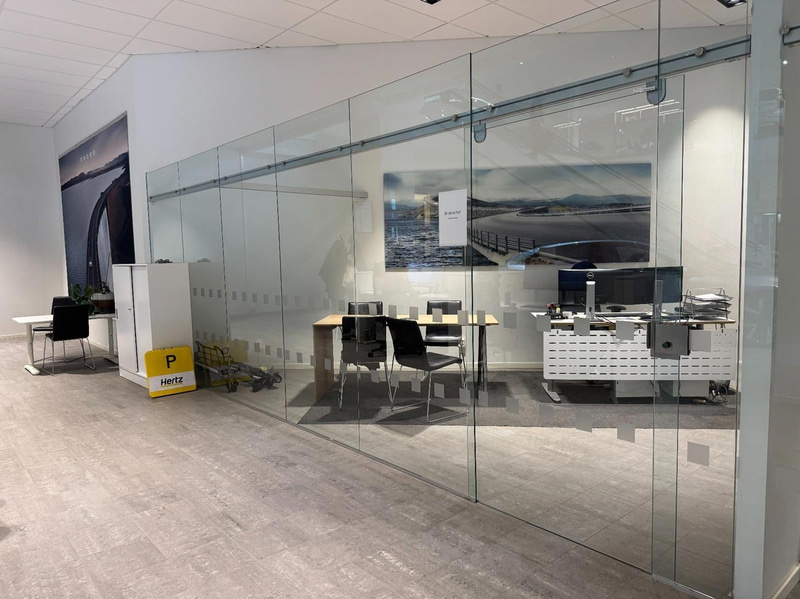 Glass partition with sliding door, 650 x 230 cm