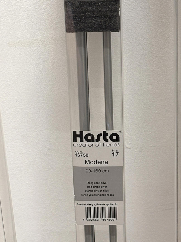Lot of curtain rods in various styles and sizes