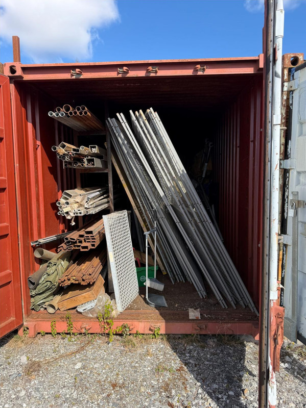 20-foot container with assorted materials (surplus materials and temporary cold-room doors)
