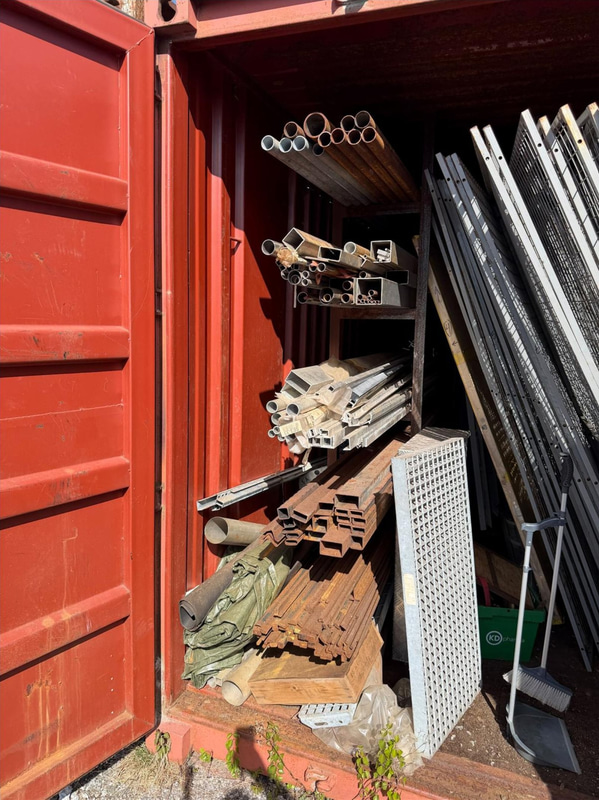 20-foot container with assorted materials (surplus materials and temporary cold-room doors)