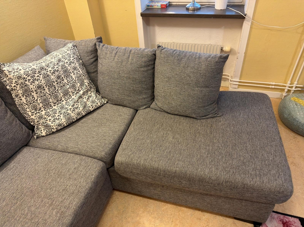 Sofa with chaise sections, coffee table and armchair