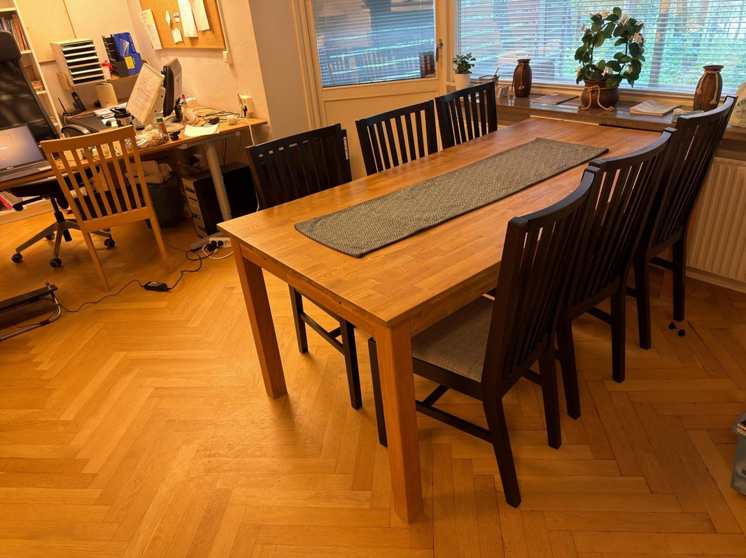 Wooden dining table with chairs