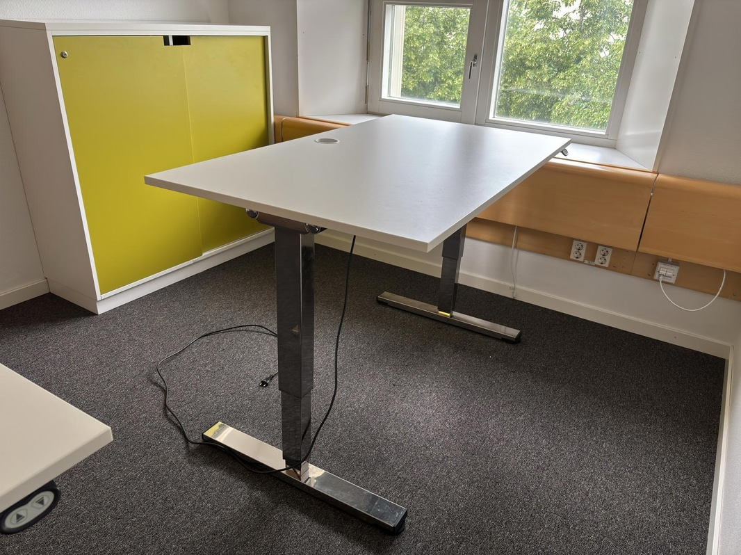 2 height-adjustable desks