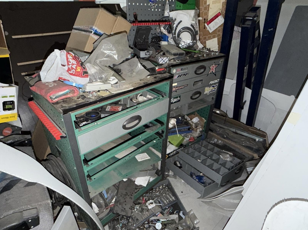 2 tool trolleys with tools and an engine hoist
