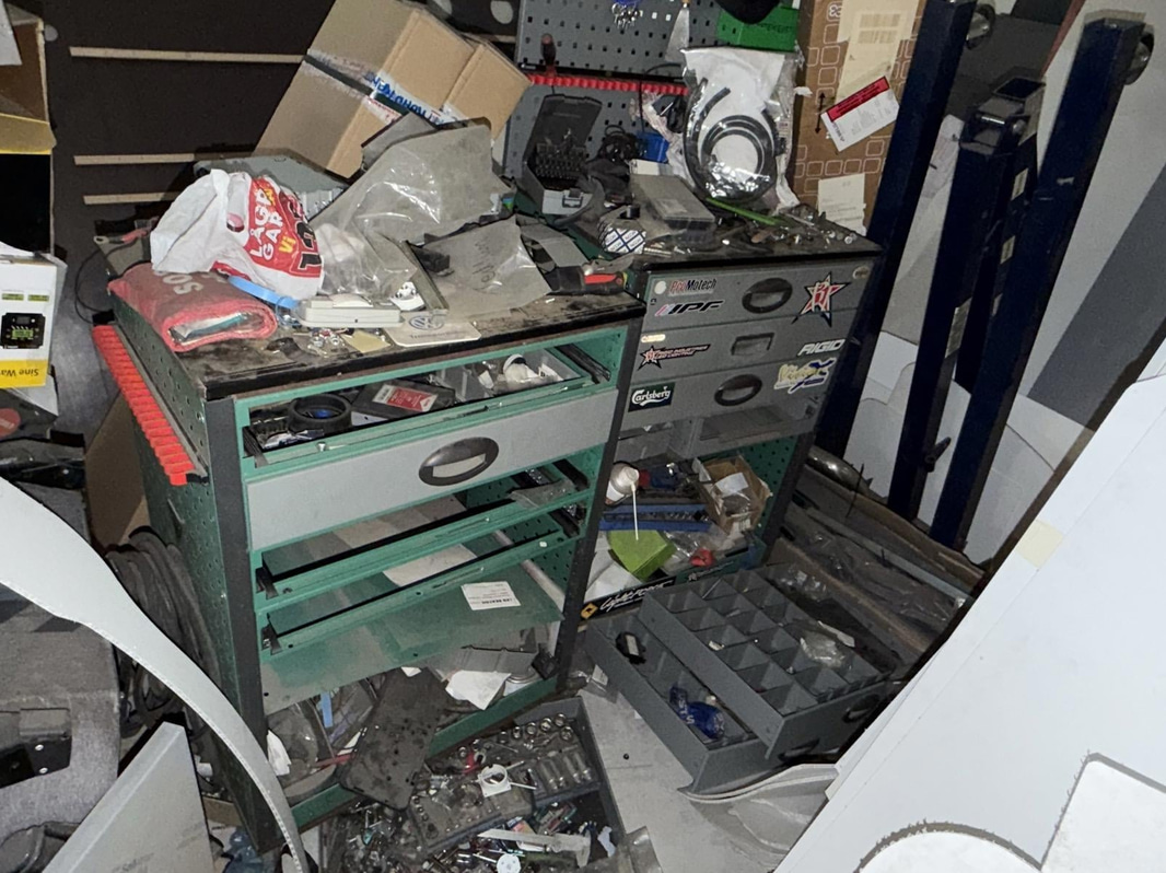 2 tool trolleys with tools and an engine hoist