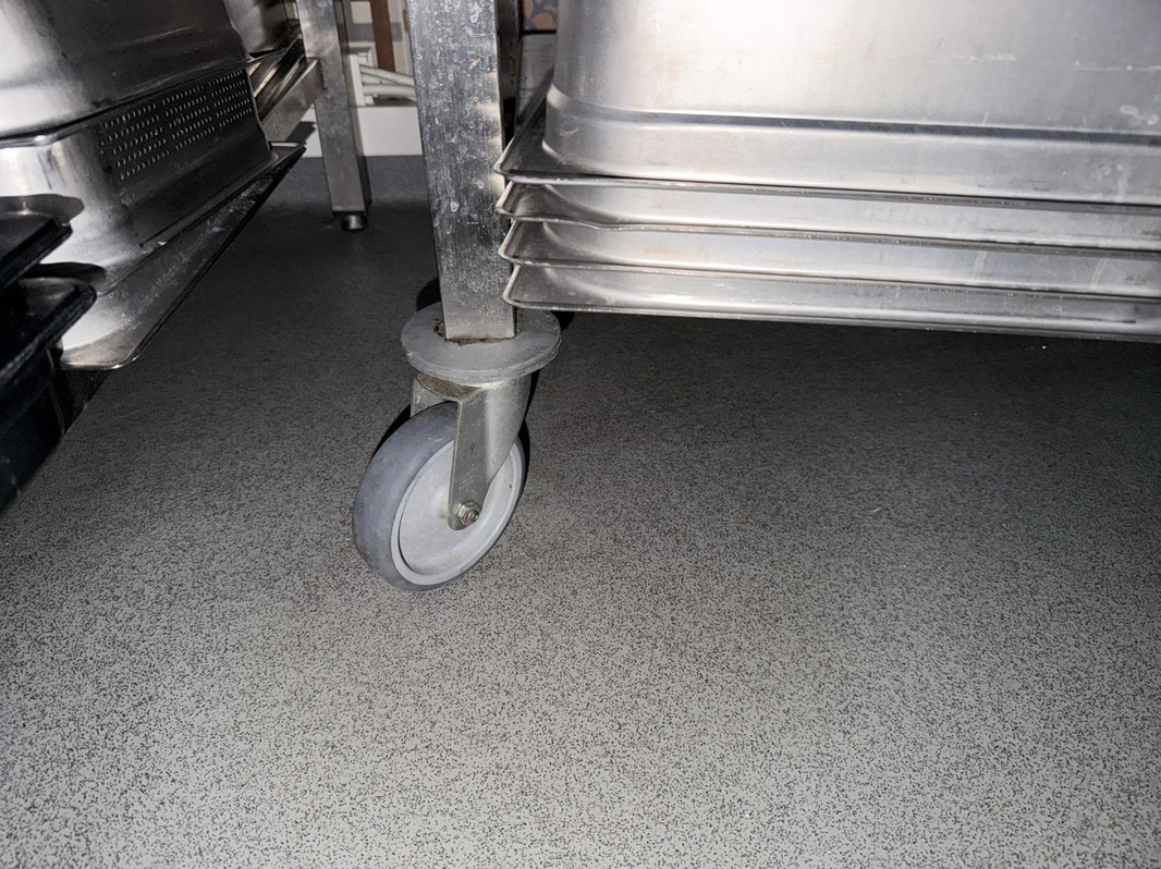 Stainless steel work table by Nova Meta, on casters