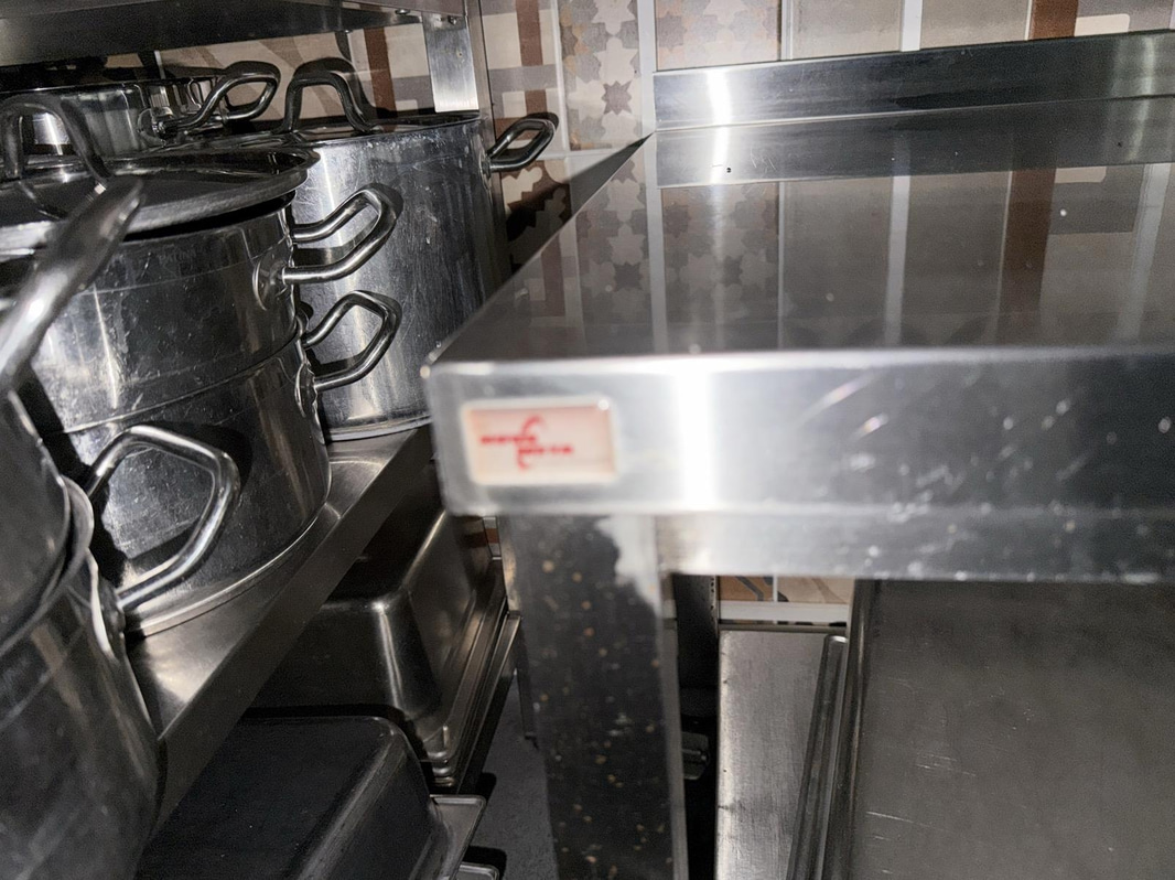 Stainless steel work table by Nova Meta, on casters