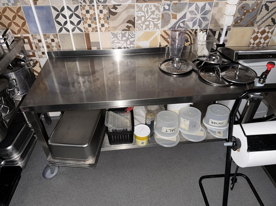 Stainless steel work table by Nova Meta, on casters