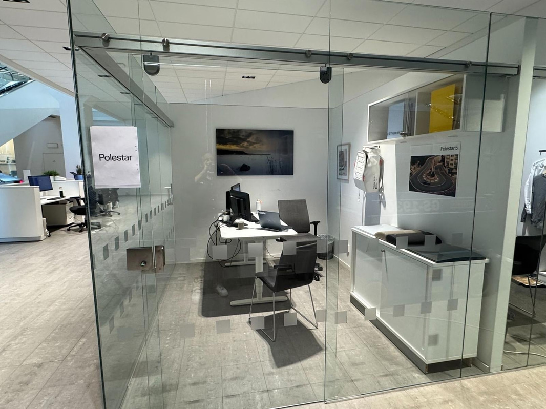 Glass partition with sliding door
