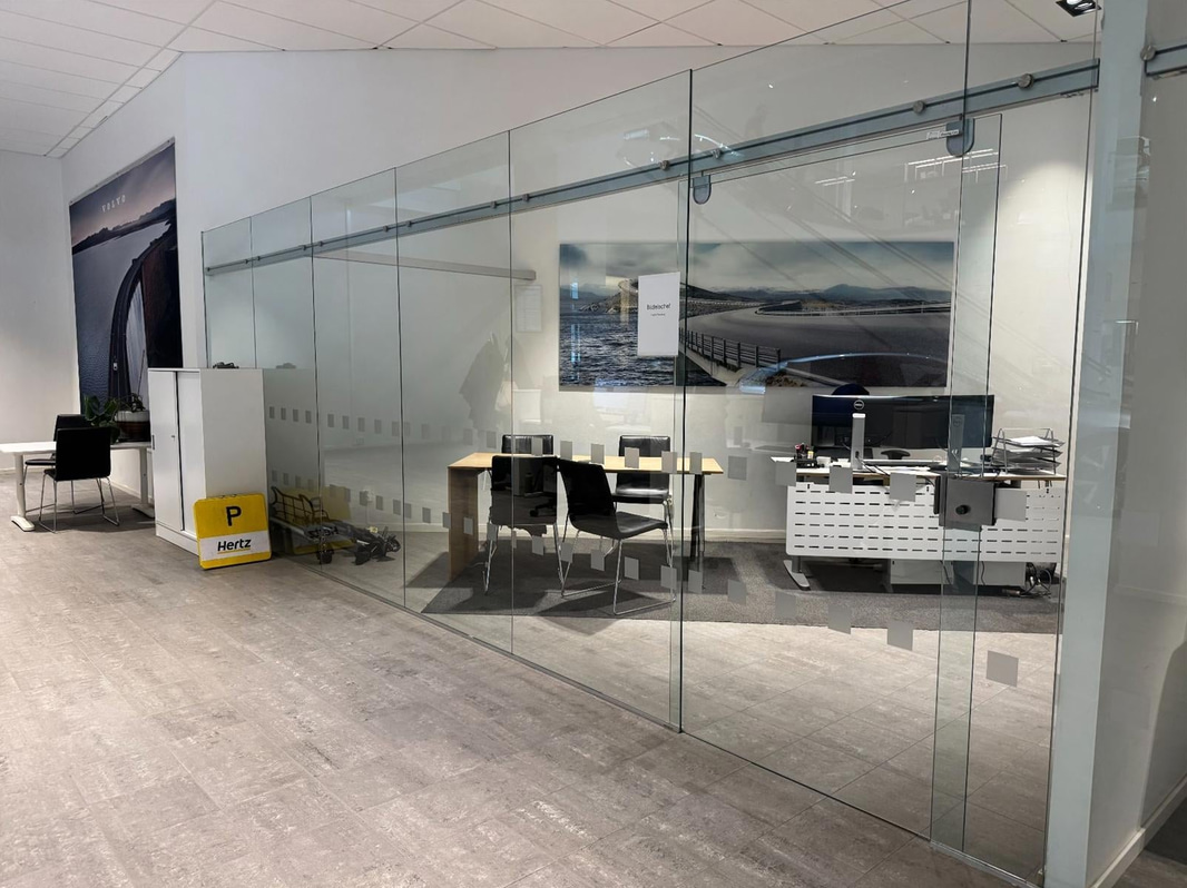 Glass partition with sliding door, 650 x 230 cm