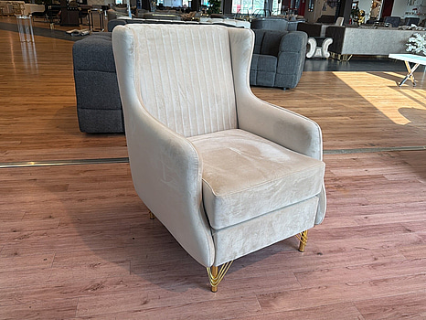 Fåtölj i beige sammet